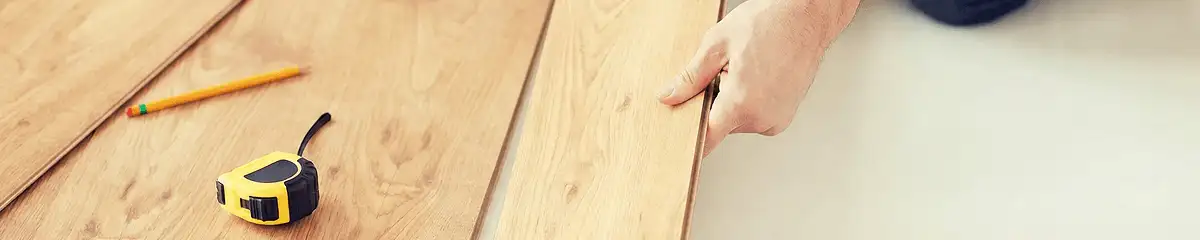 A professional installing wood flooring in Salt Lake City, UT