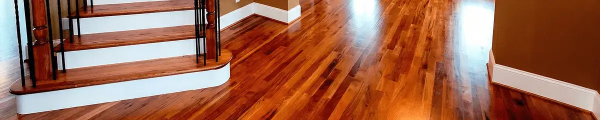 Base floor of a staircase with professionally restored wood flooring in Salt Lake City UT