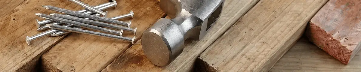 Hammer and nails on hardwood flooring boards in Salt Lake City, UT
