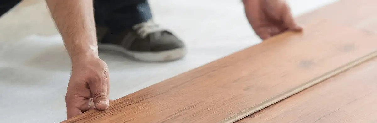A professional installing laminate flooring in Salt Lake City, UT