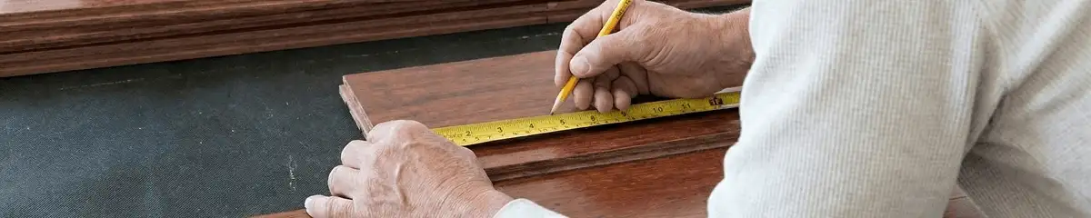 A professional installing wood flooring in Salt Lake City, UT